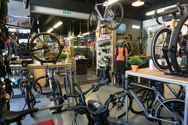 The interior of  the awards winning Rockets and Rascals bike shop in Poole, Dorset. Premium bikes can be seen throughout the store with vintage memorabilia on the walls as well as the latest accessories and clothing.