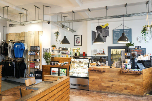The Serving and deli counter of Rockets and Rascals cycling themed cafe in Poole showcasing artisan coffee, lunches and snacks locally sourced in Poole.