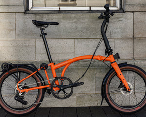 A fully serviced Orange Brompton G-Line outside the workshop at Rockets and Rascals bike shop in Poole, Dorset.