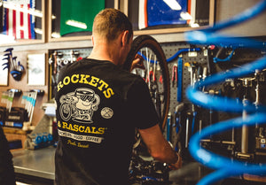 Professional bicycle mechanic services a bicycle wheel in the workshop at Rockets and Rascals Poole, Dorset.