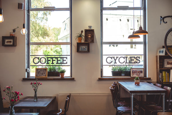 The window display of Rockets and Rascals Cycling Cafe in Poole, Dorset. The window reads 
